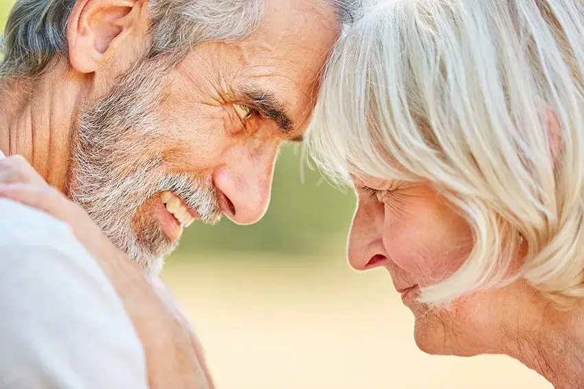 Get Quality Dentures If Your Partner Wants You To_-min Happy senior couple looking into one another eyes and smiling