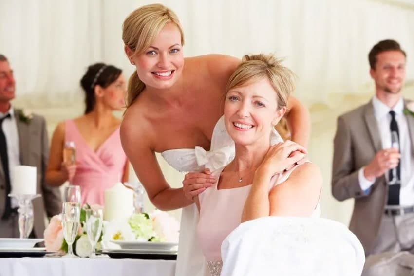 Blushing bride with her mother