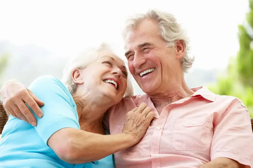 Quality Dentures Offer a Better Experience-min Older couple enjoying each other company and laughing