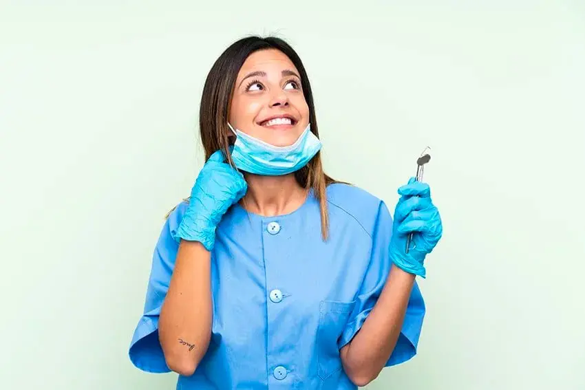 woman dentist looking up in the sky, smiling