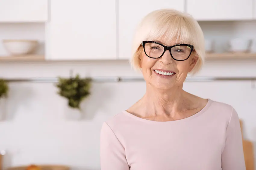 An-Alternative-to-the-Food-Processor–Better-Dentures happy older woman standing in her kitchen